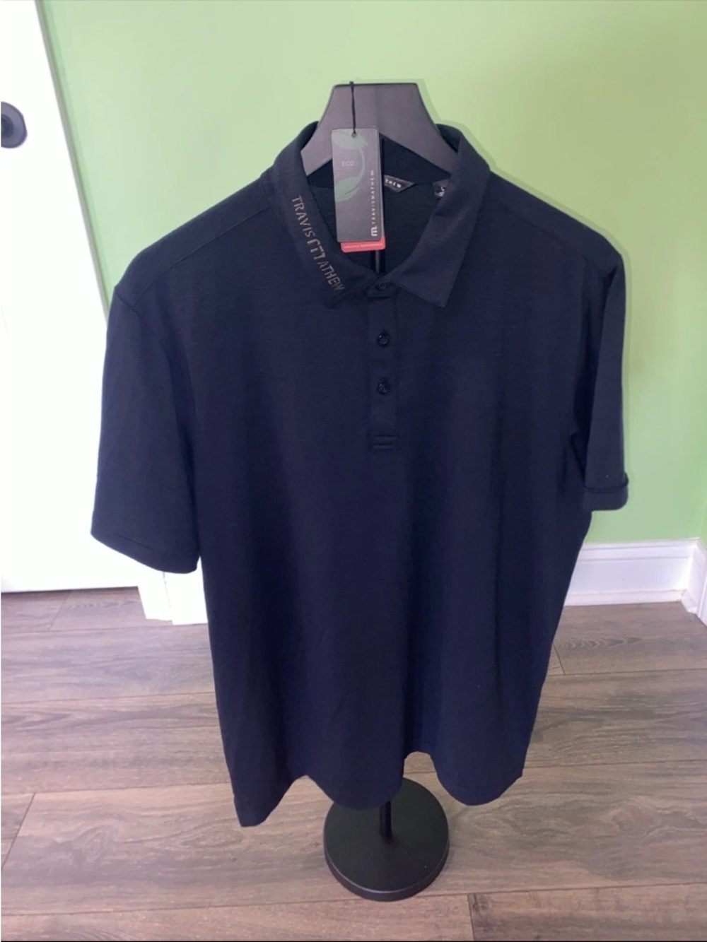 Travis Mathew Men's Black Polo with Subtle Logo Collar